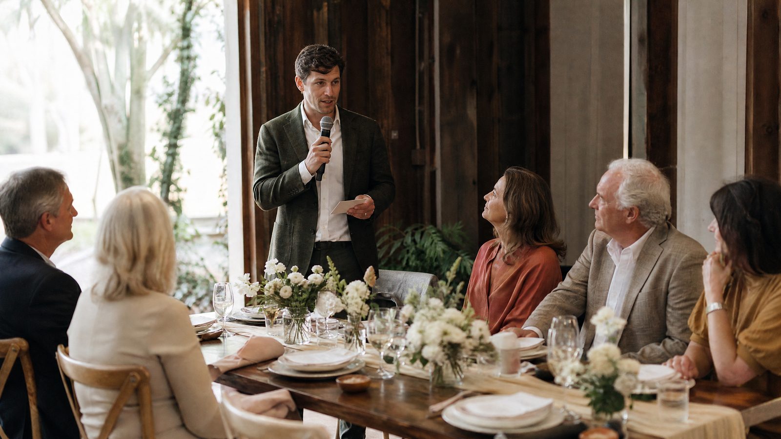 A host using one cue card to give a short rehearsal dinner toast